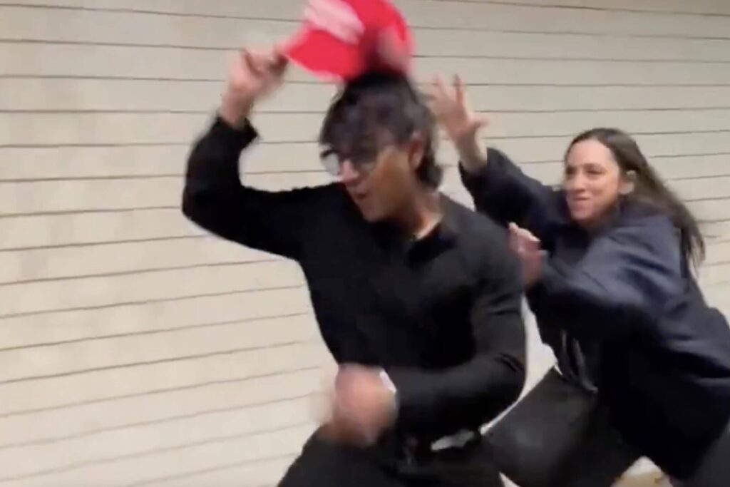 WATCH: Liberal Faceplants While Trying To Steal Man's MAGA Hat
