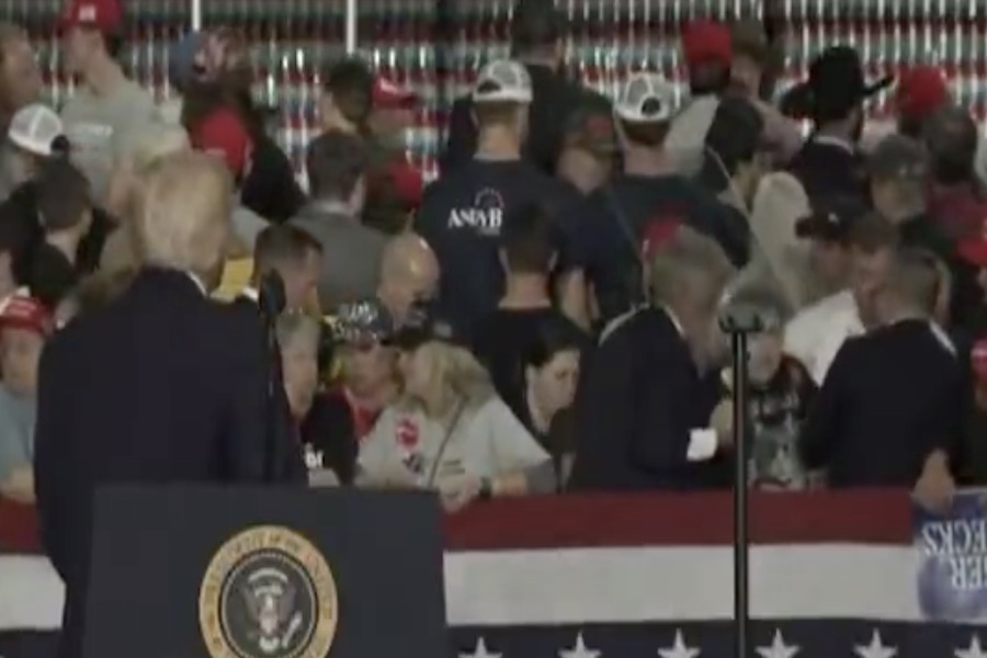 WATCH: Trump Official Leaps Into Action After Woman Faints At Kentucky Rally